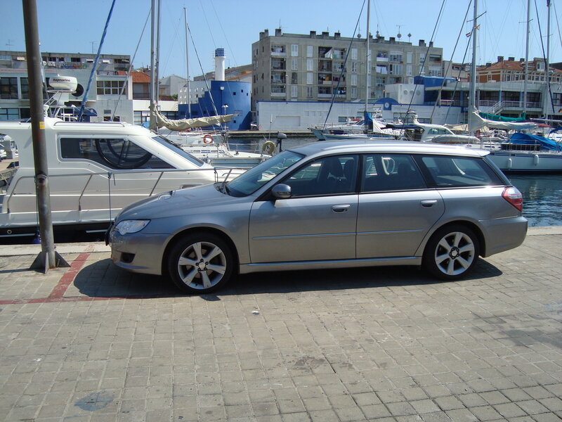 Silver station wagon at marina