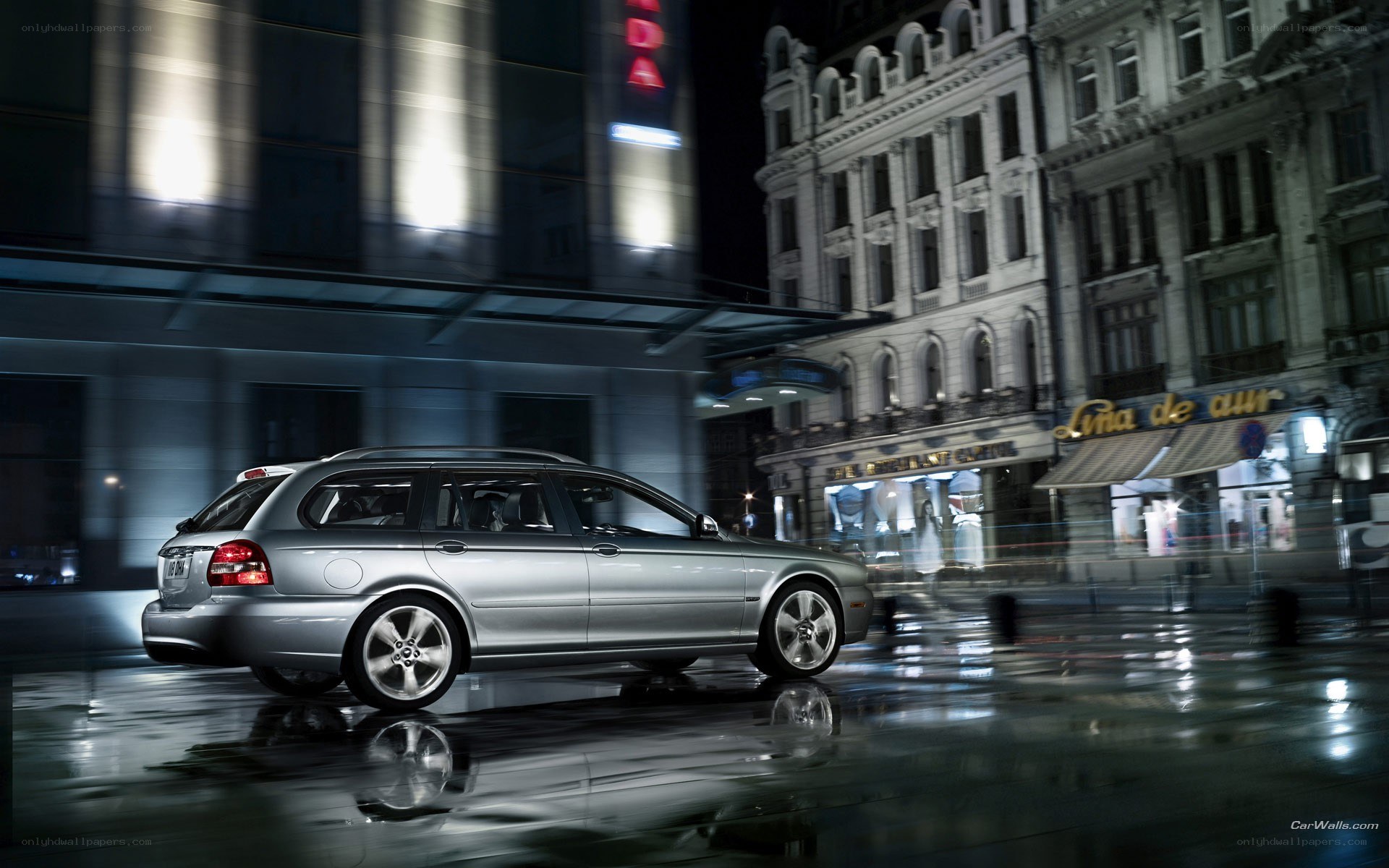 Silver station wagon at night