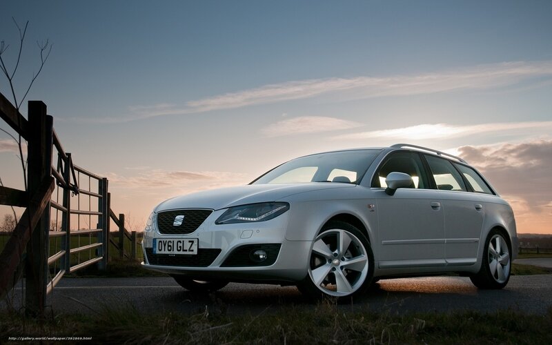 silver station wagon at sunset