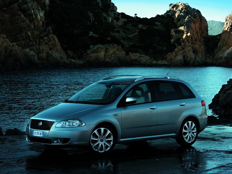 Silver station wagon by the sea