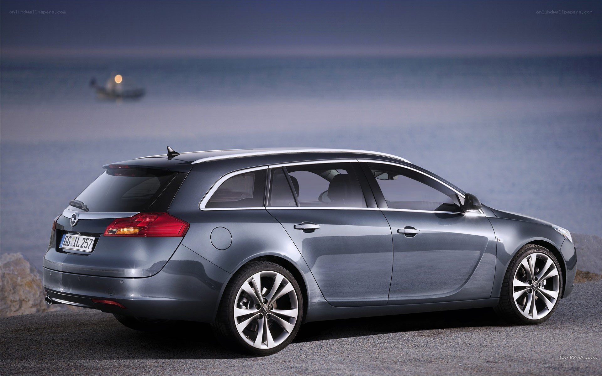 silver station wagon by the sea