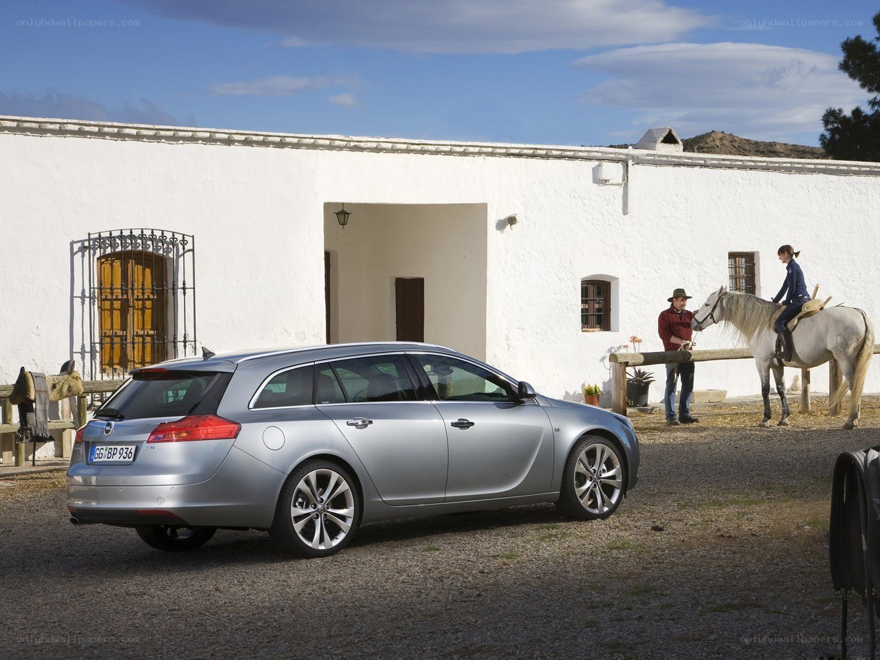 Silver station wagon in courtyard