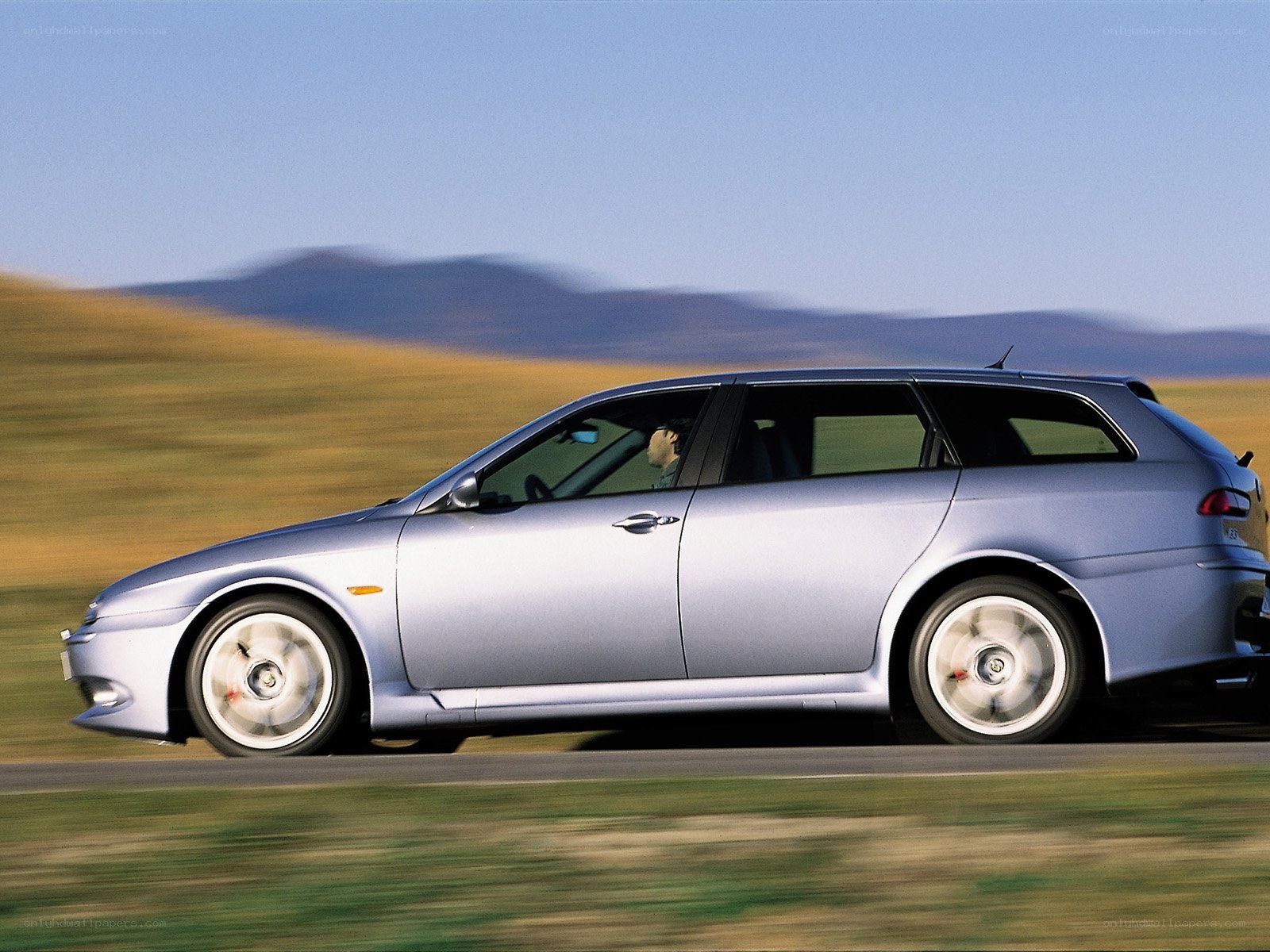 silver station wagon in motion