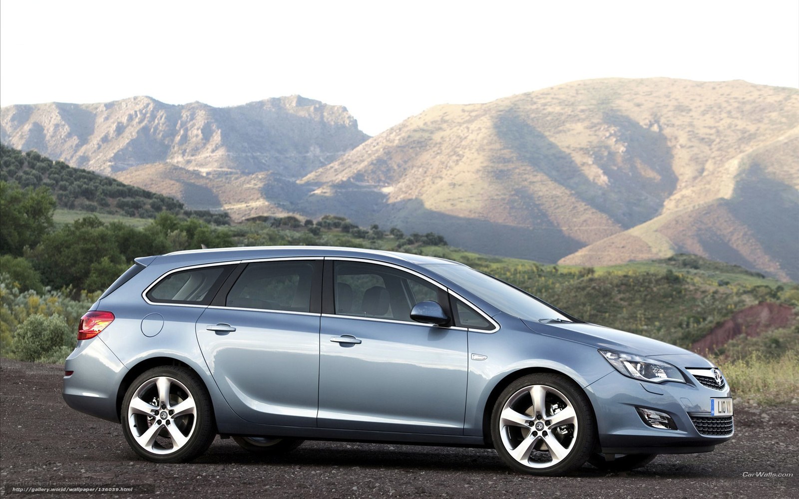 silver station wagon in mountains