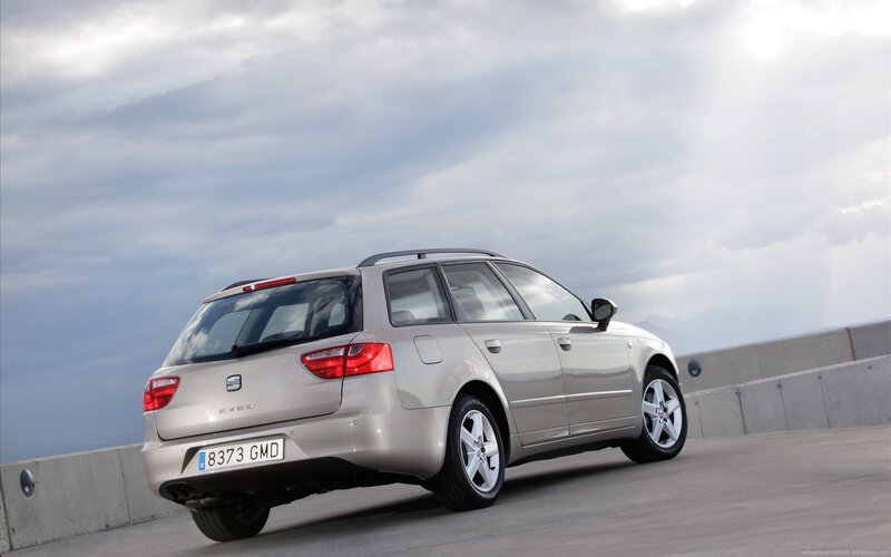 silver station wagon on a bridge