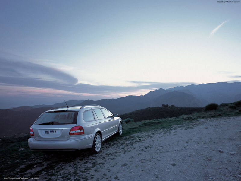 Silver station wagon on mountain road