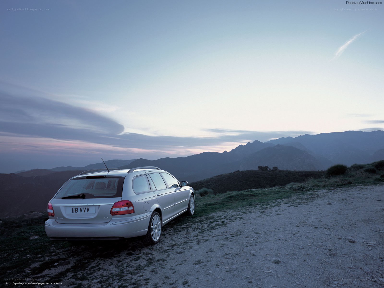 Silver station wagon on mountain road