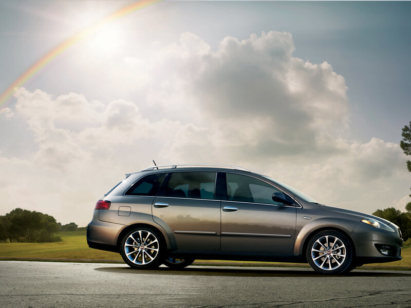 silver station wagon on road