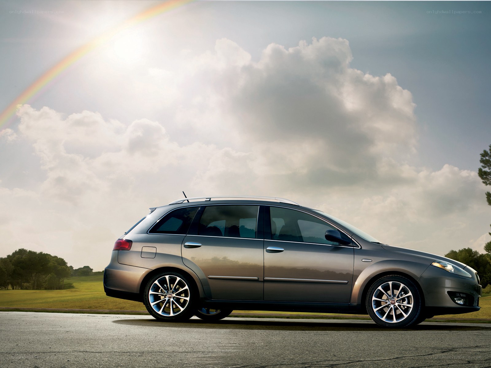 silver station wagon on road