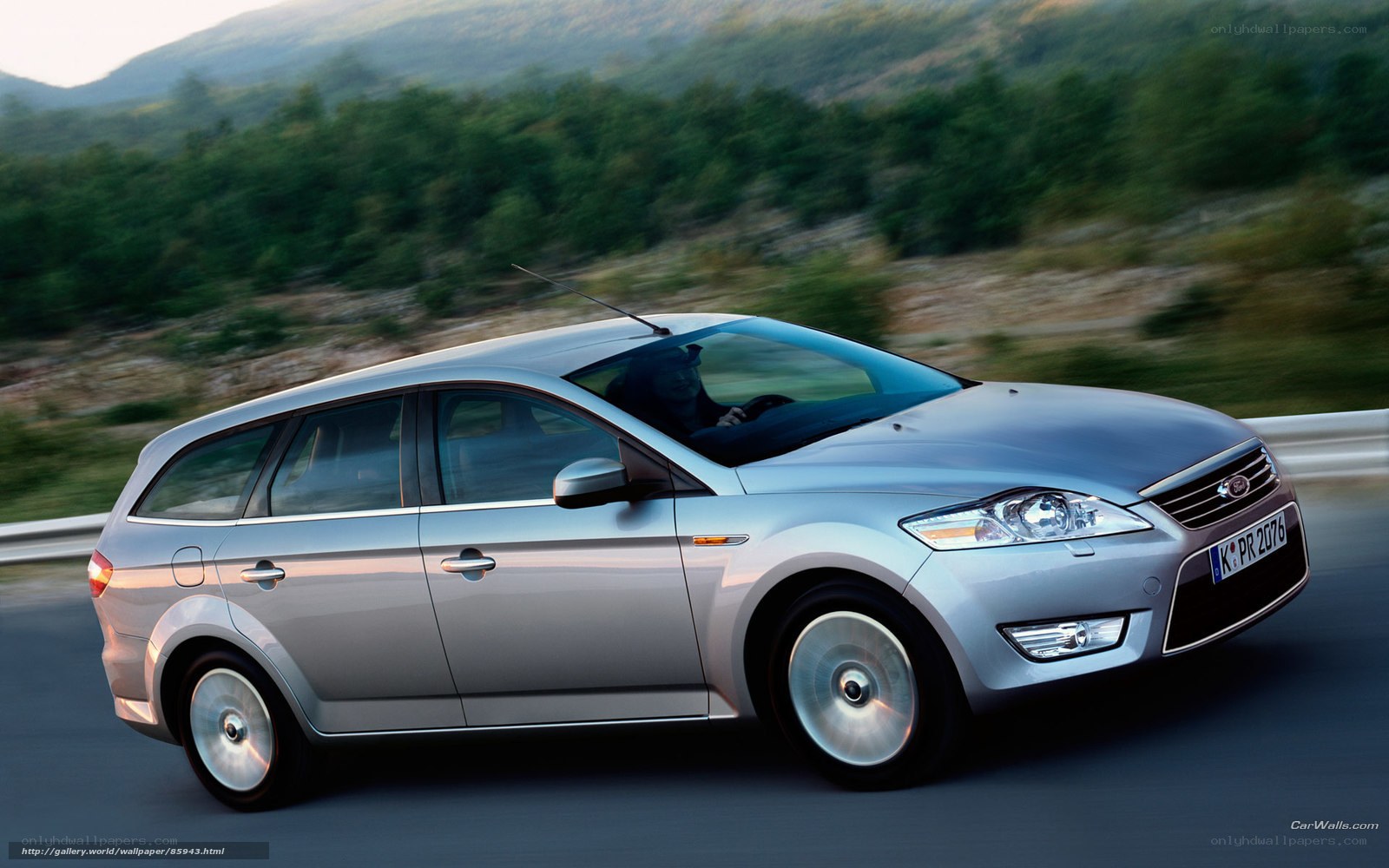 silver station wagon on road