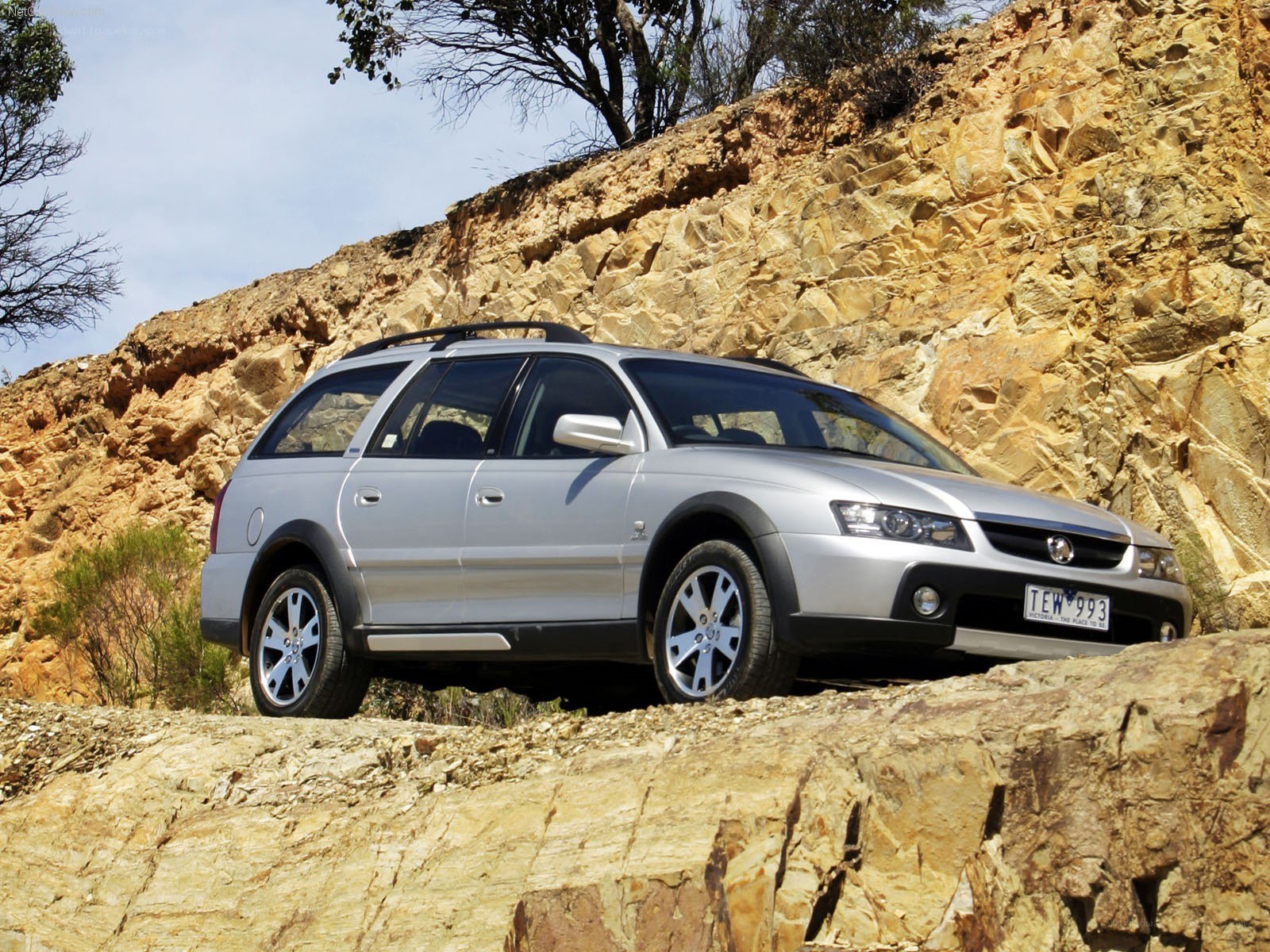 silver station wagon on rocky terrain