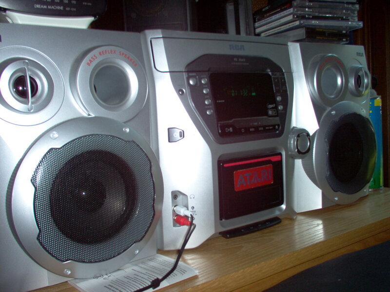 silver stereo system with speakers
