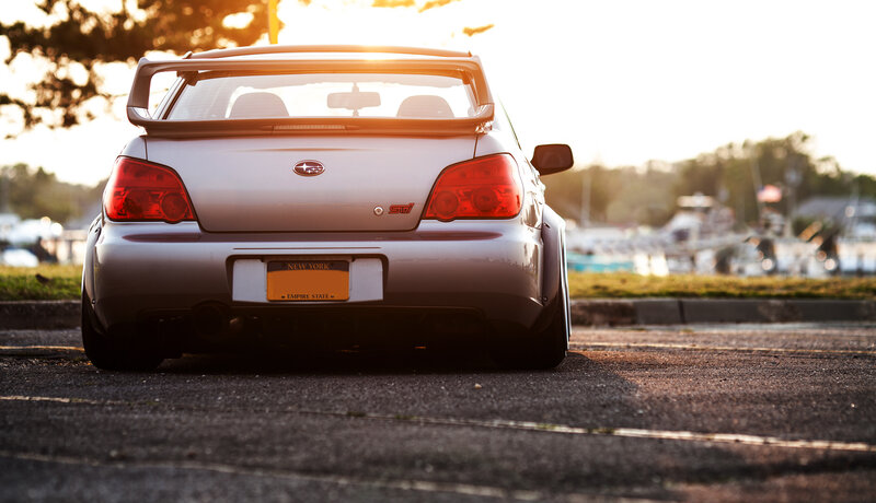 silver subaru at sunset