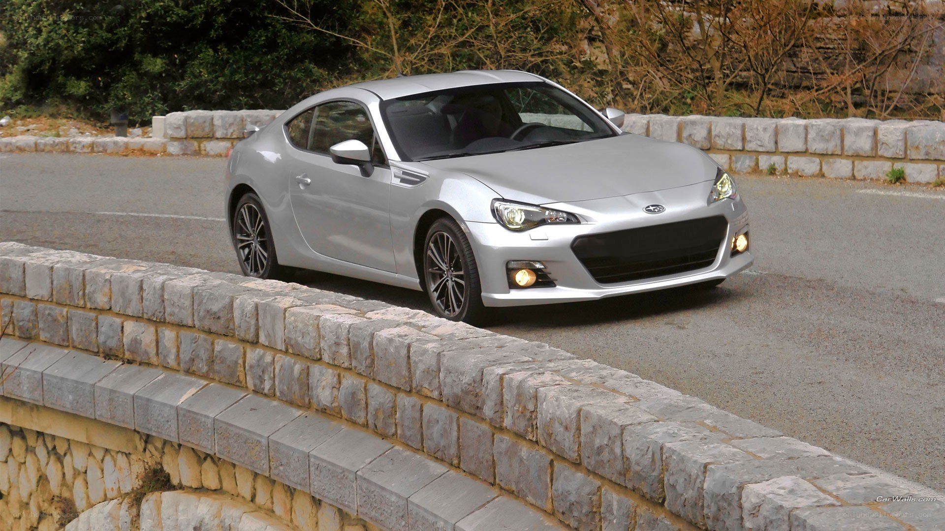 silver subaru brz on a road