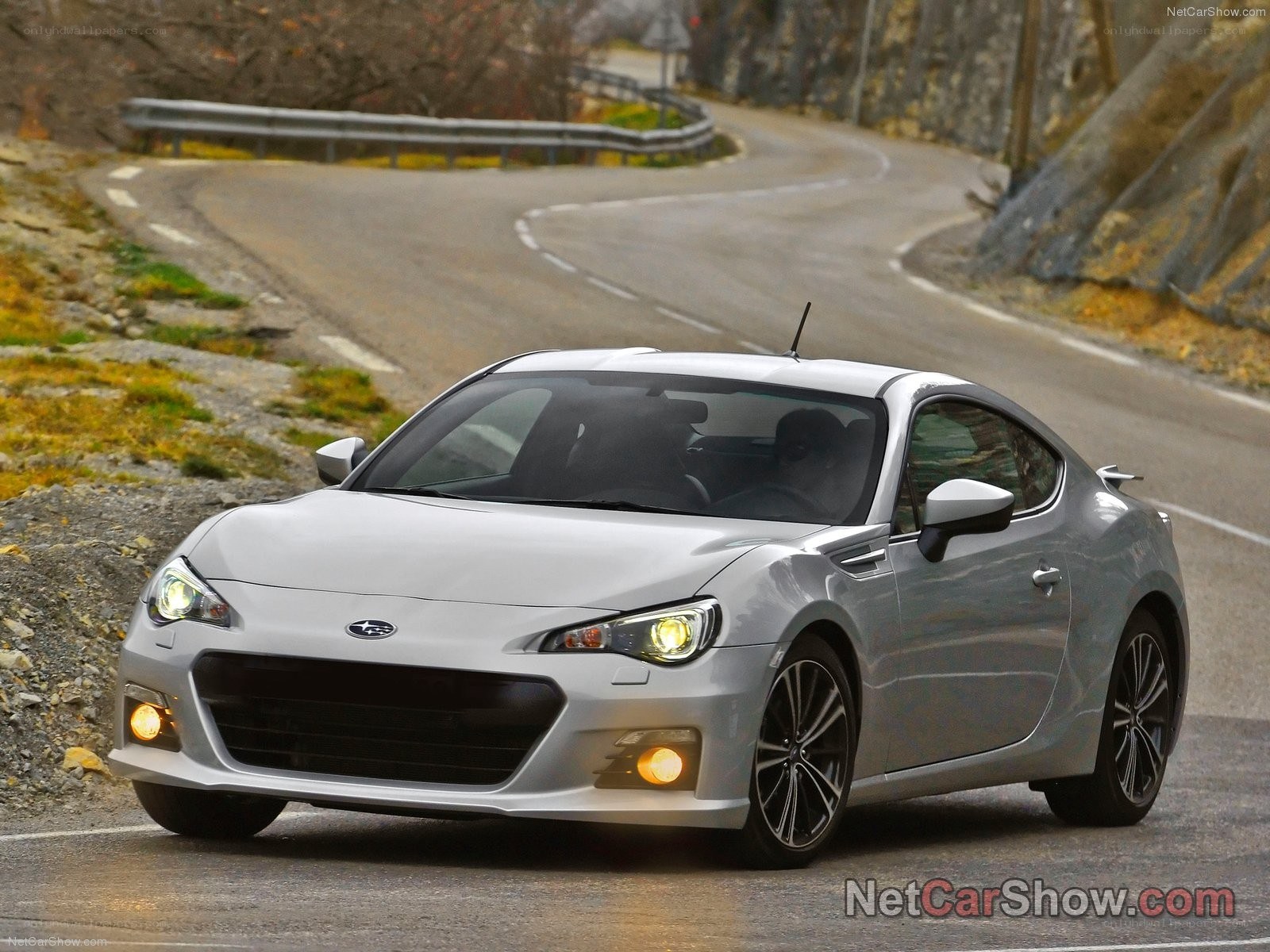 silver subaru brz on winding road