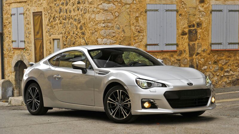 Silver Subaru BRZ parked in village