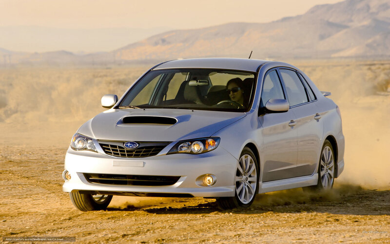 silver subaru driving on dirt