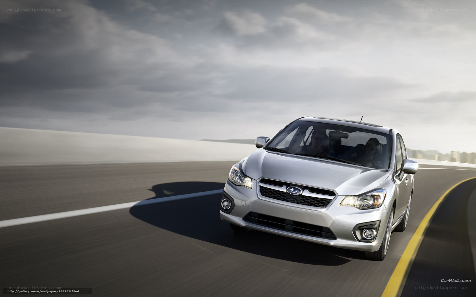 silver subaru driving on highway