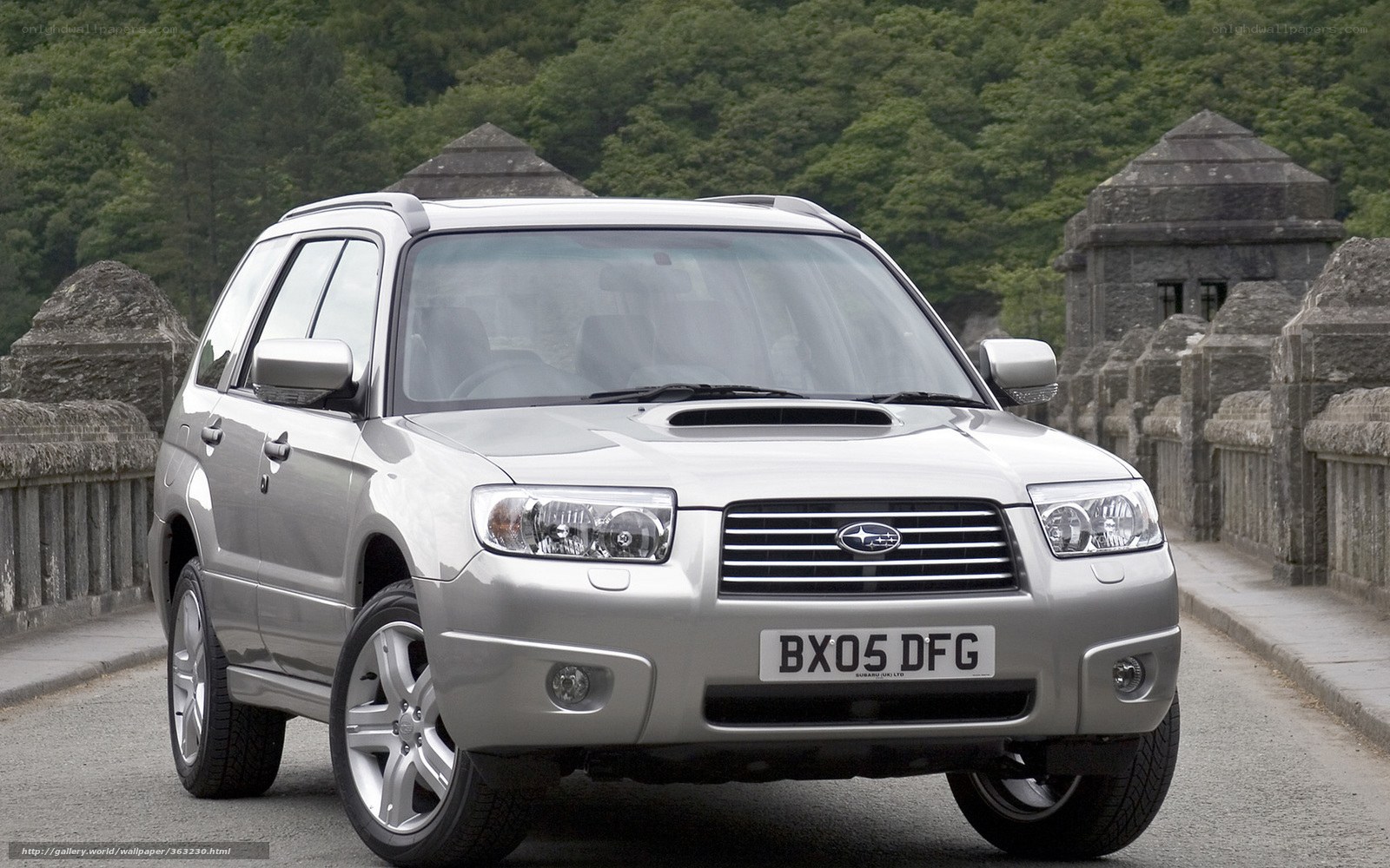 silver subaru forester on a bridge
