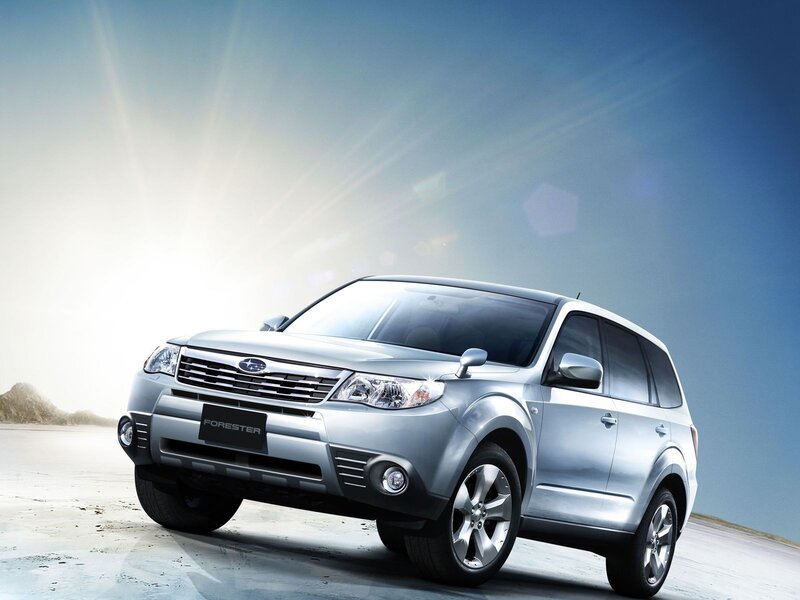 Silver Subaru Forester on beach