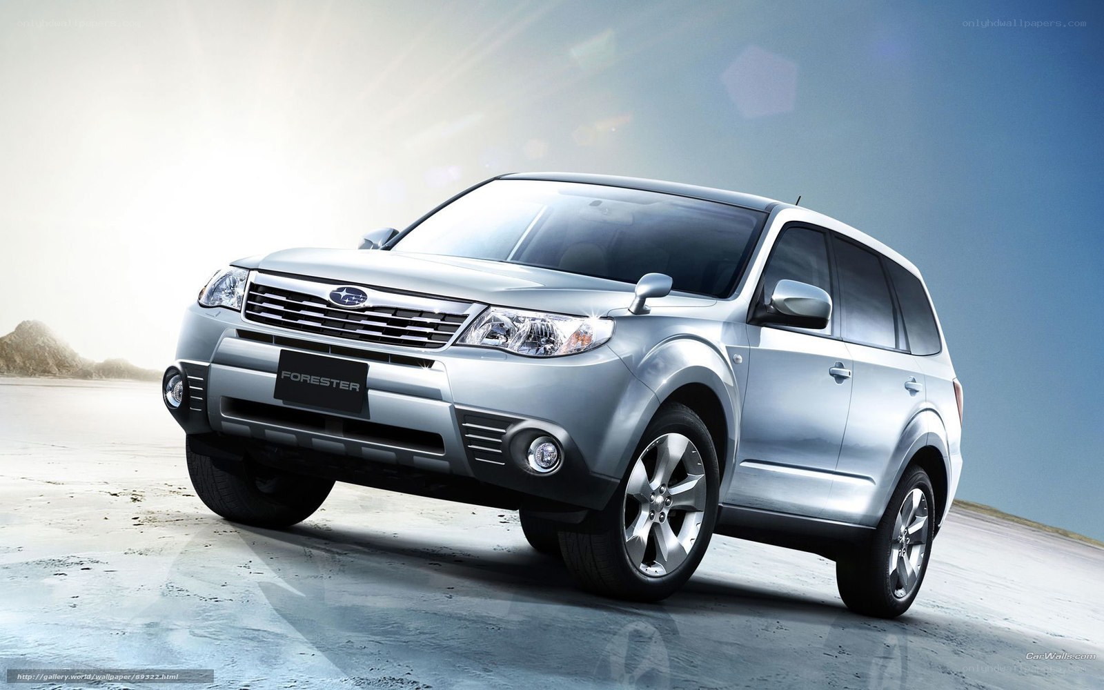 Silver Subaru Forester on beach