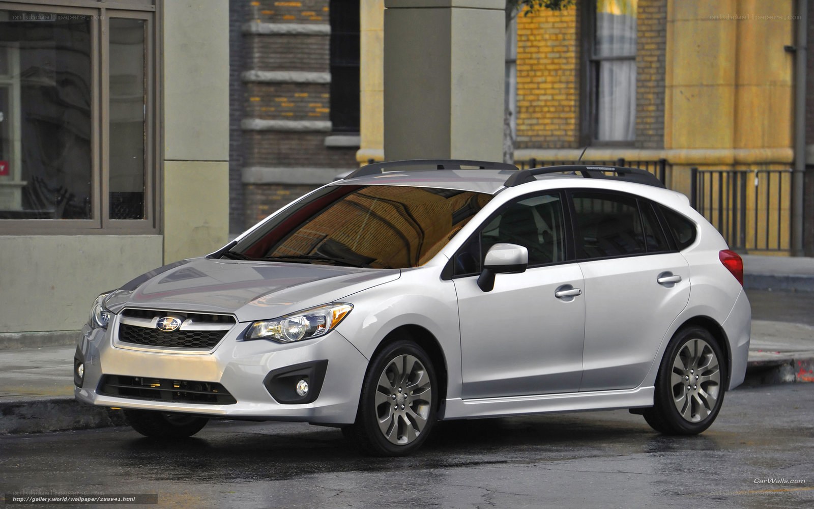 silver subaru hatchback on city street