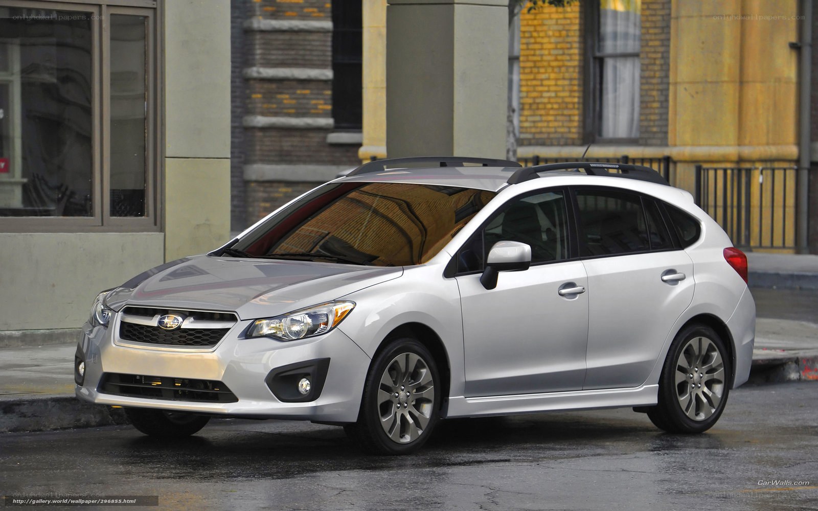 silver subaru hatchback on street