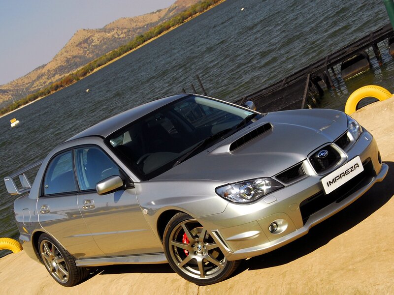 silver subaru impreza by the lake