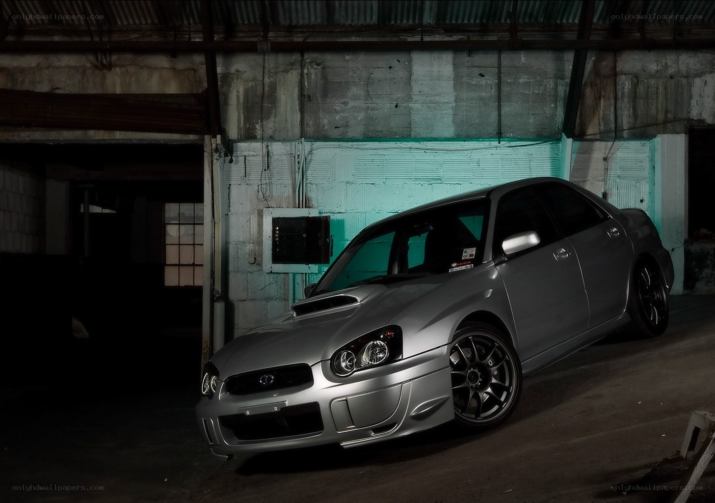 silver subaru in garage