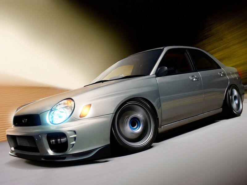 silver subaru in motion