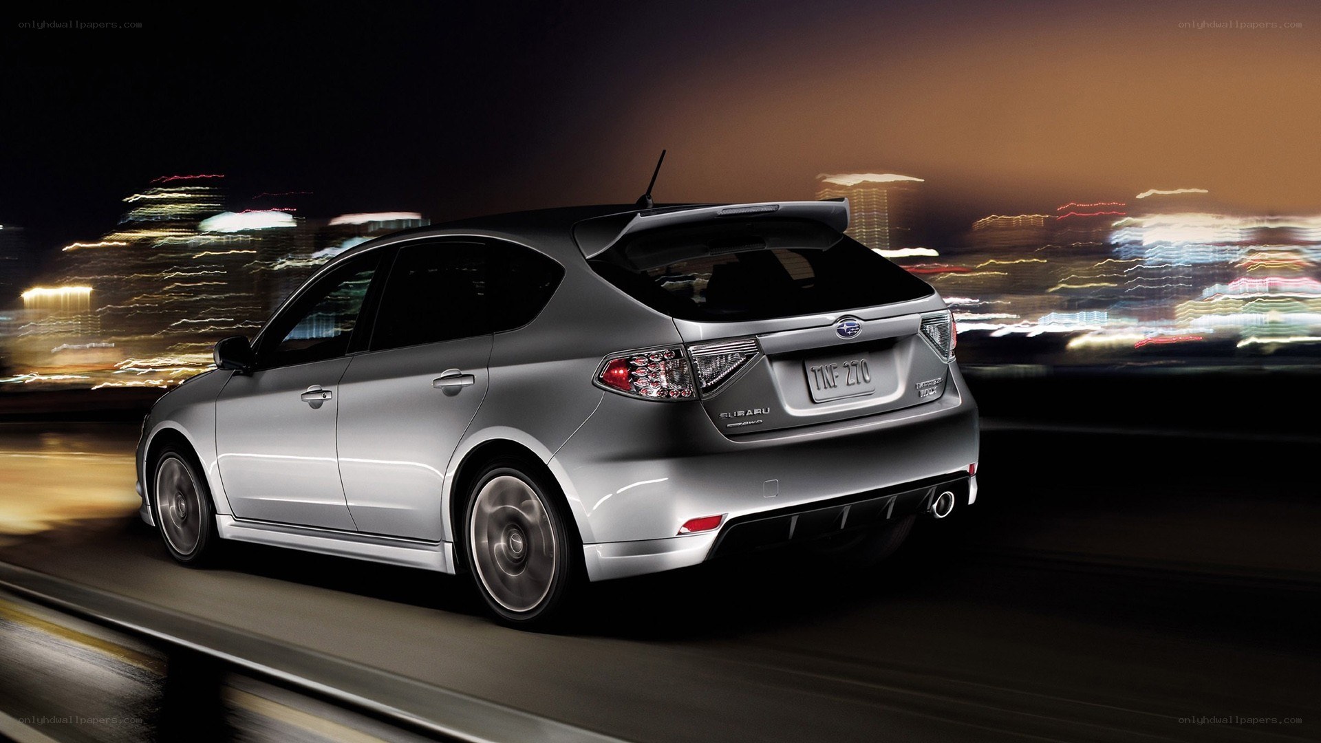 silver subaru in motion at night