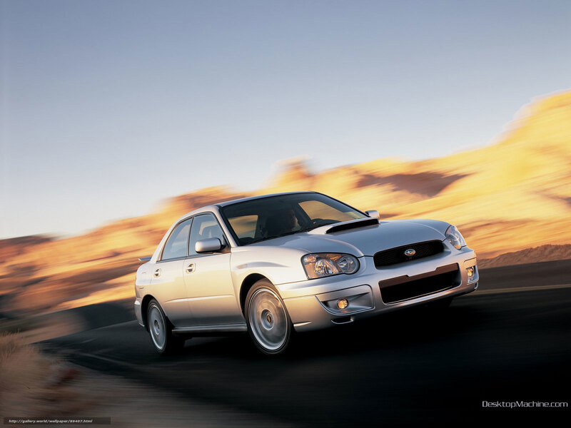 silver subaru in motion