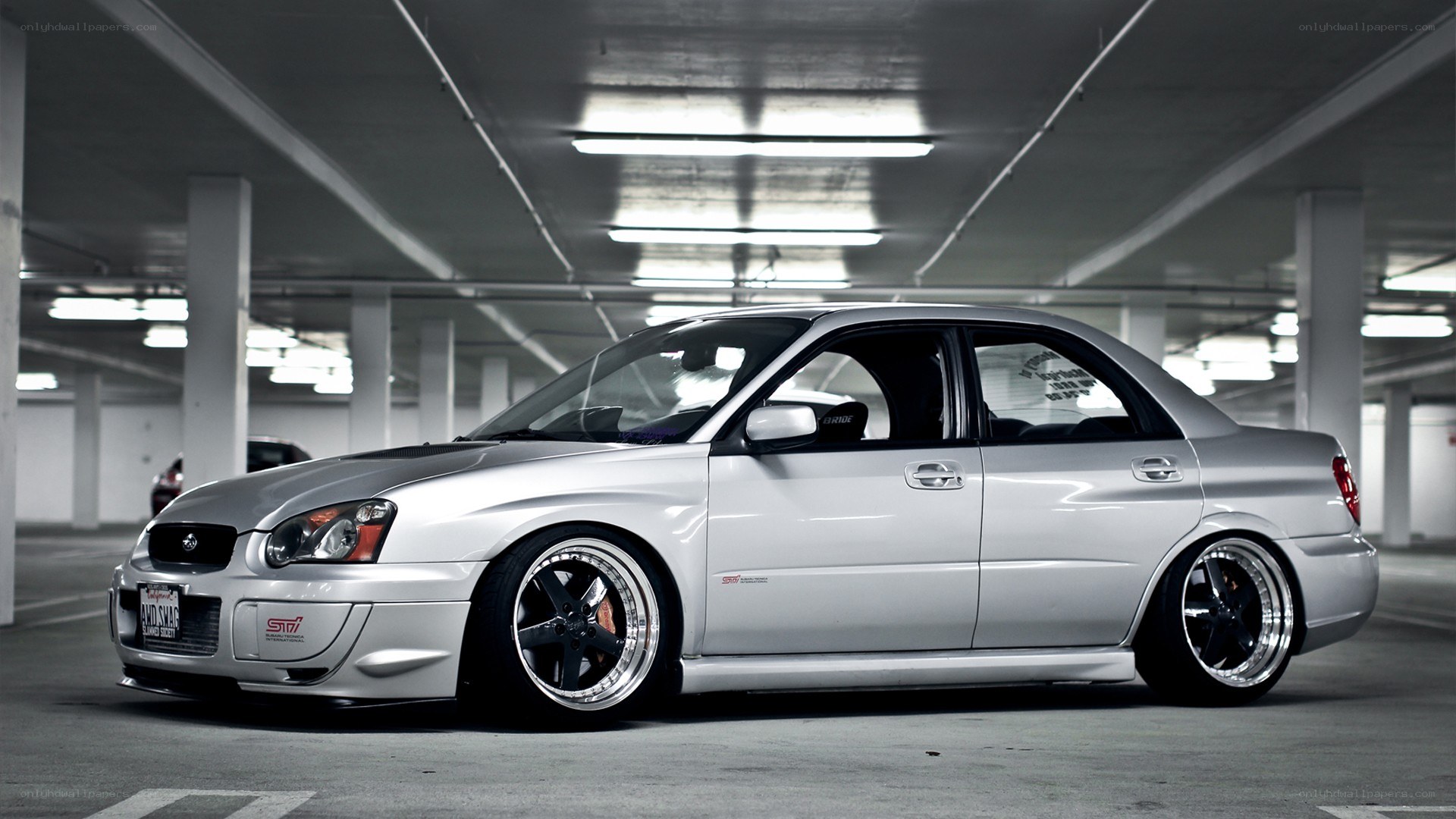 silver subaru in parking garage