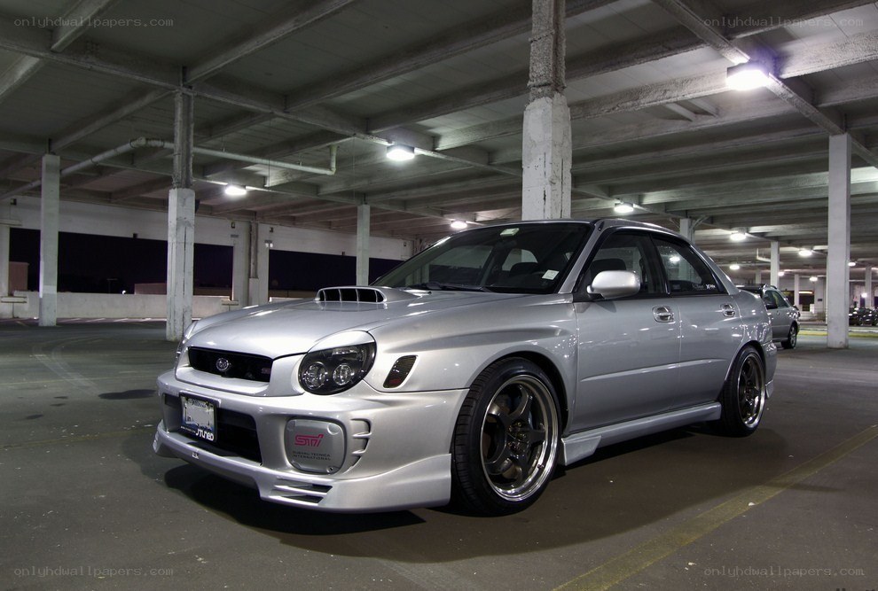 silver subaru in parking garage