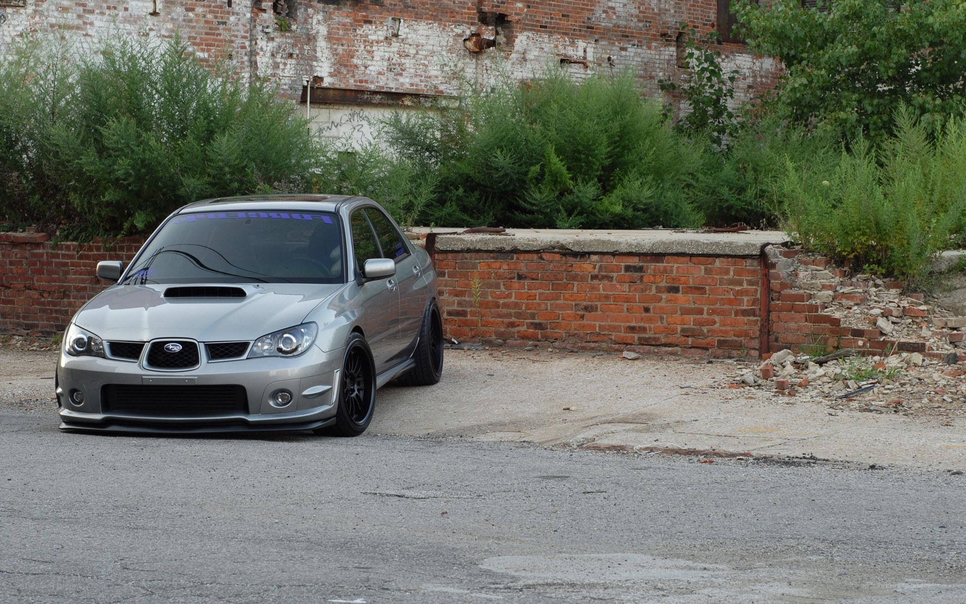 silver subaru in urban setting