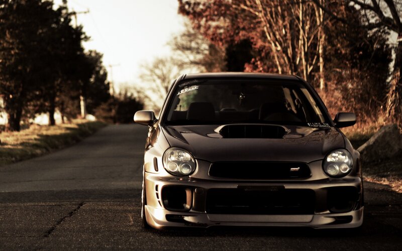 silver subaru on a country road