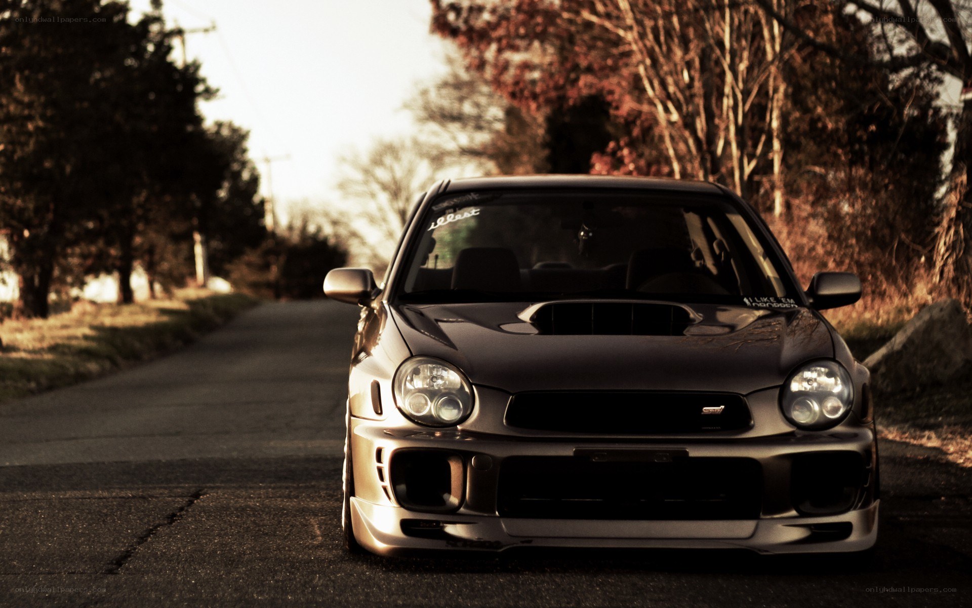 silver subaru on a country road