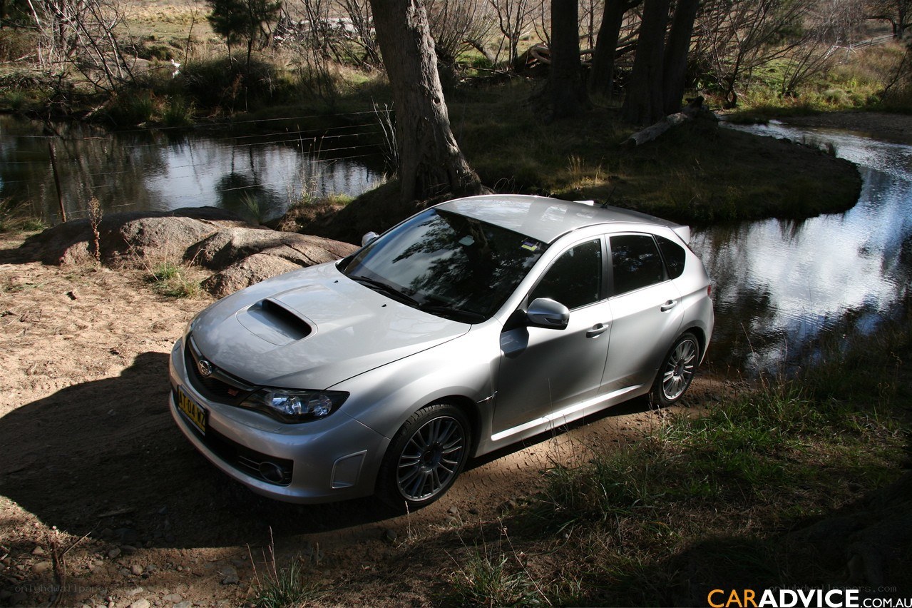 Silver Subaru on riverbank