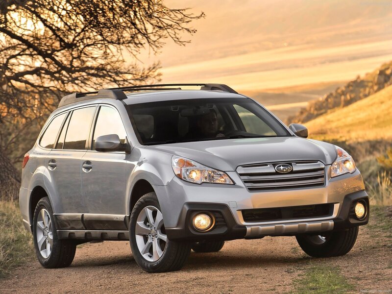 Silver Subaru Outback on a dirt road