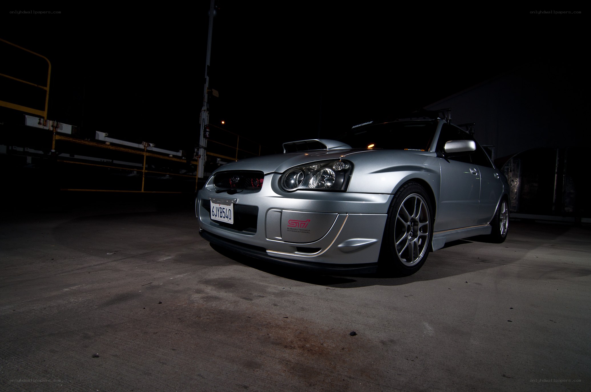silver subaru sti at night