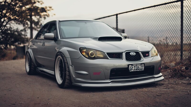 silver subaru sti on dirt road