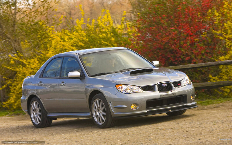 Silver Subaru WRX on a dirt road