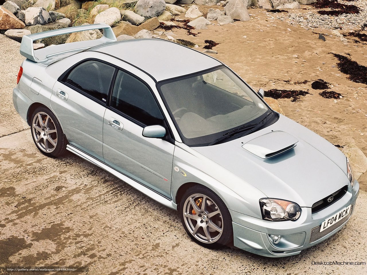 silver subaru wrx on beach