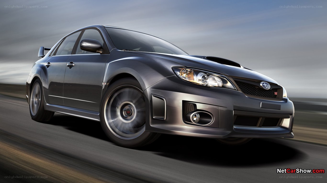 silver subaru wrx sti in motion