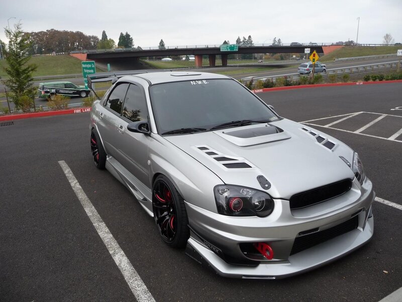 silver subaru wrx sti in parking lot