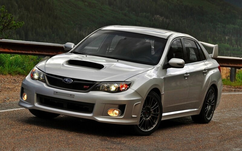 silver subaru wrx sti on mountain road