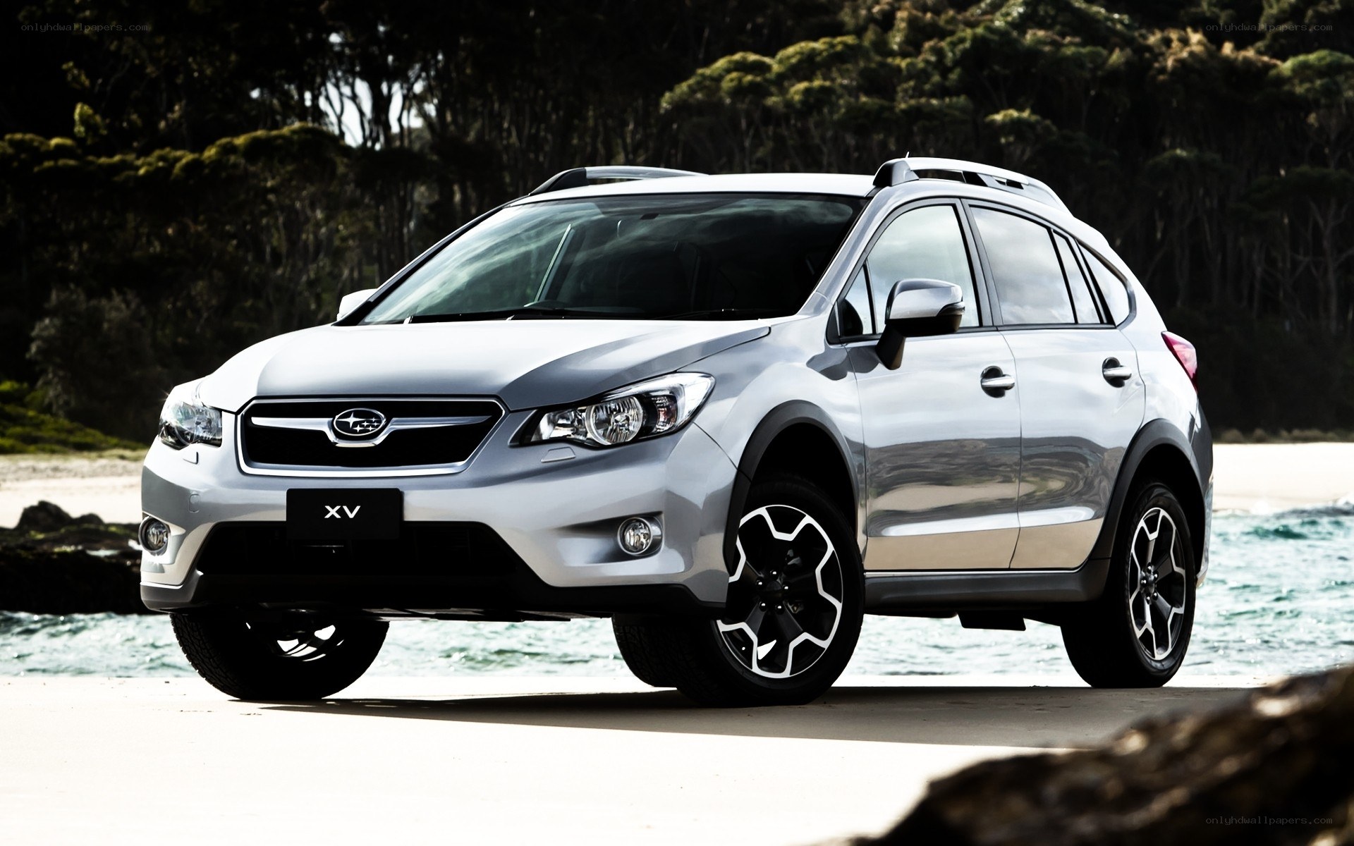 Silver Subaru XV on beach