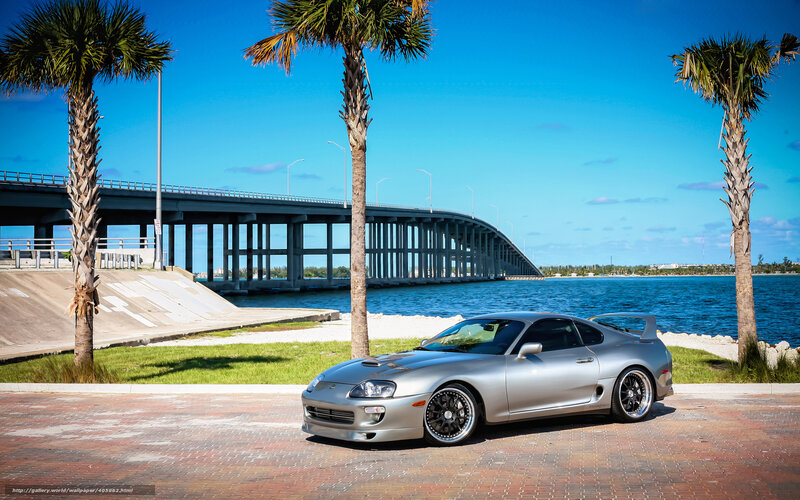 Silver Supra by the water