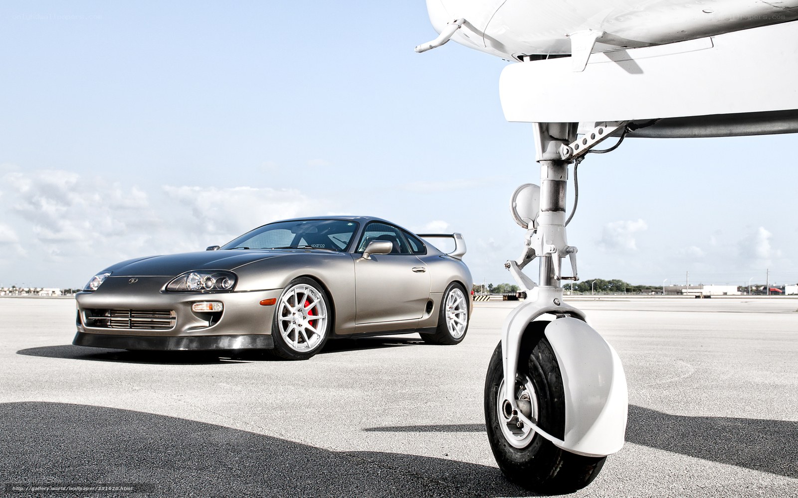 Silver Supra on tarmac