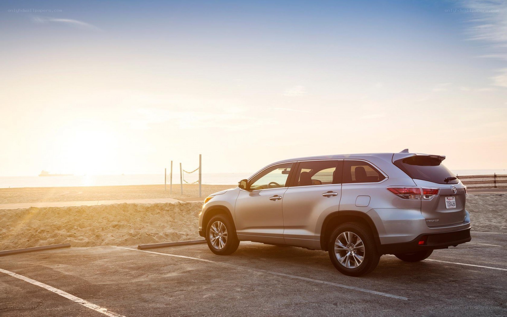 Silver SUV at beach parking